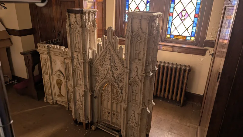 Dismantled Gothic church architecture with stained glass — pieces of faith, stored in silence