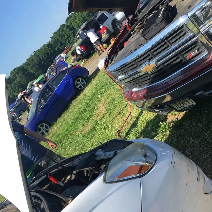 cars with hoods open in a field (2022-06-24)