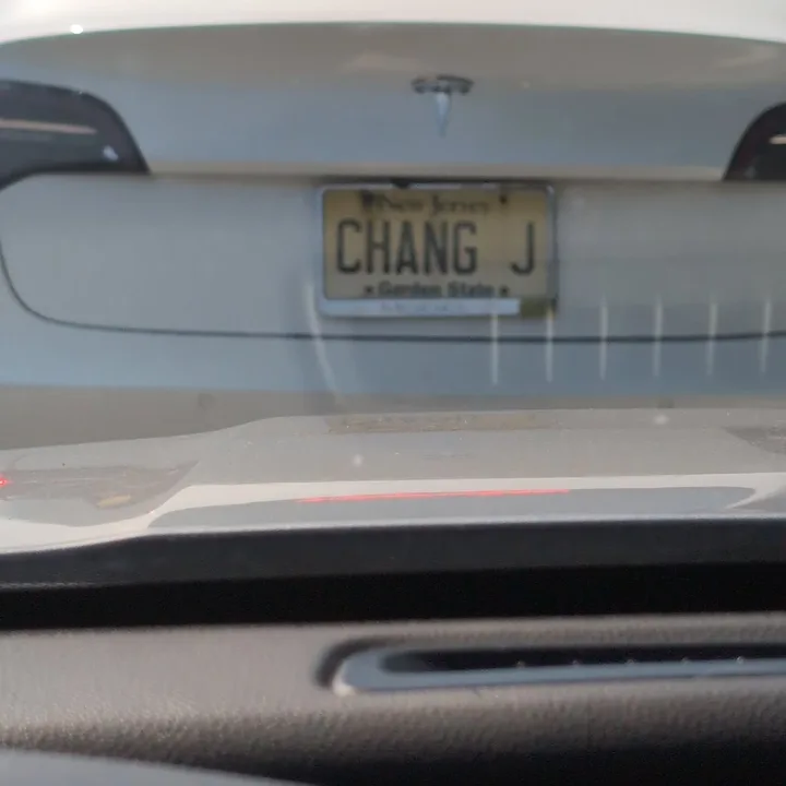 white tesla with vanity plate (2025-08-10)